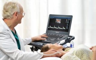 doctor using vascular ultrasound